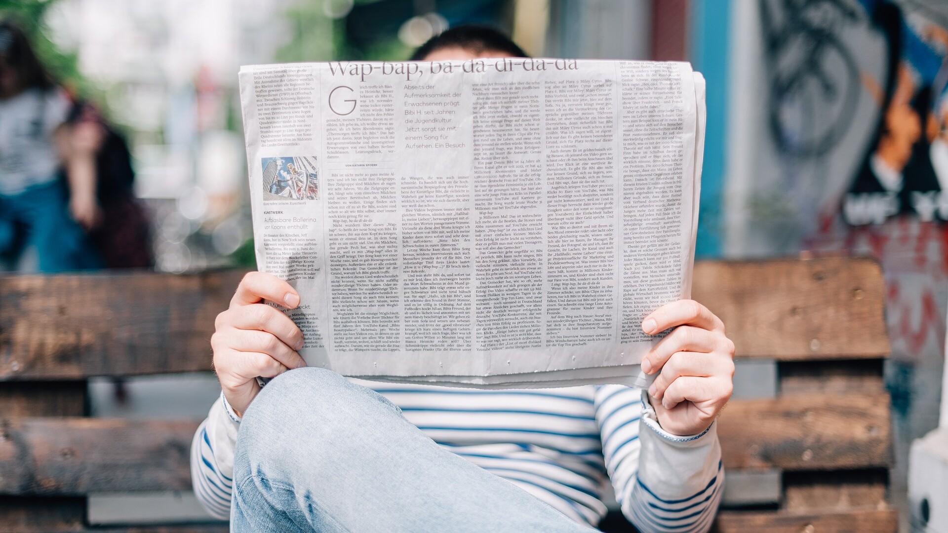 man reading news paper about ERP software