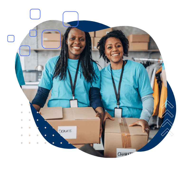 This is an image of two women packing up boxes to be donated.